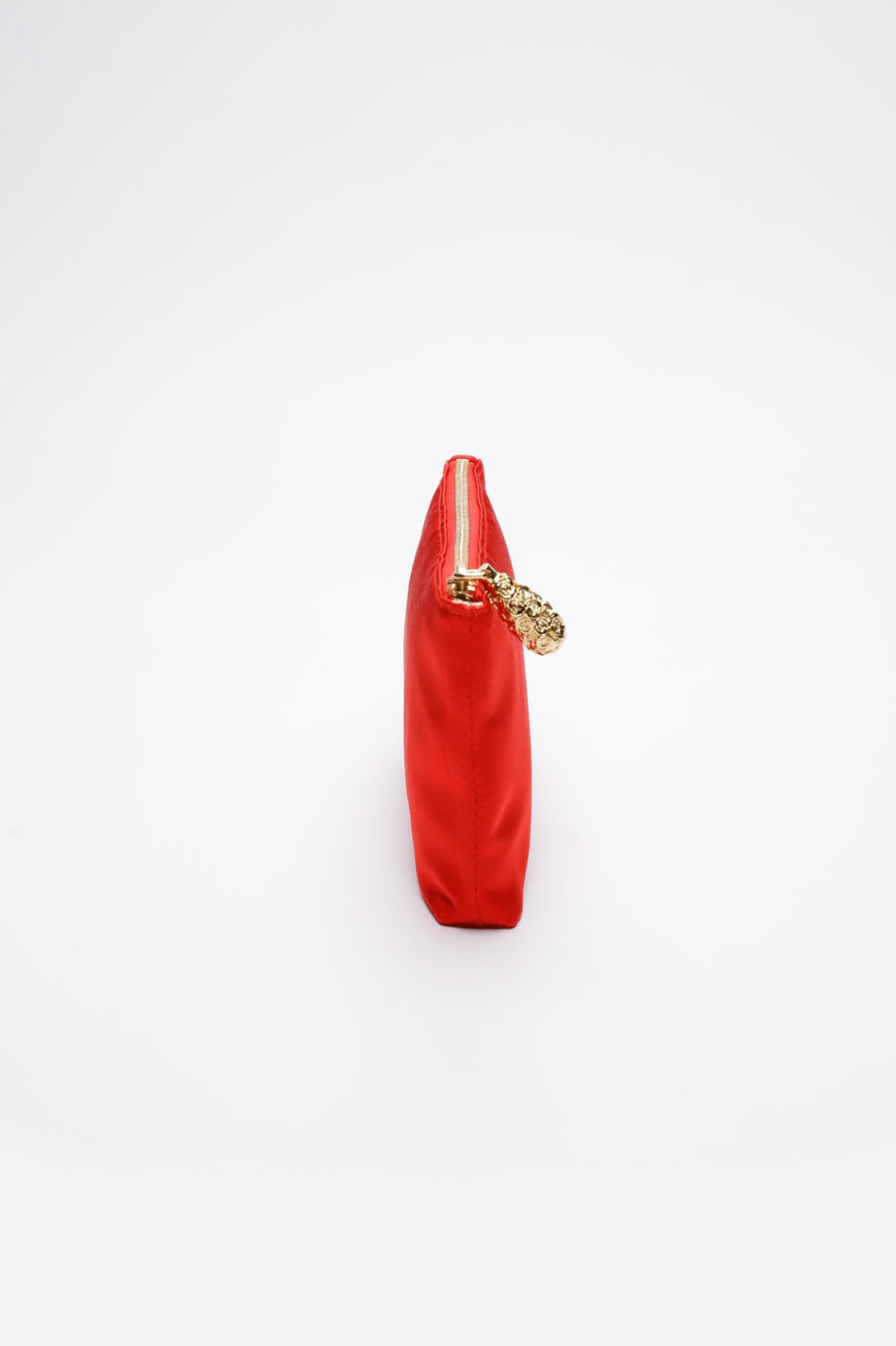 Side view of Red satin pouch with gold zipper.
