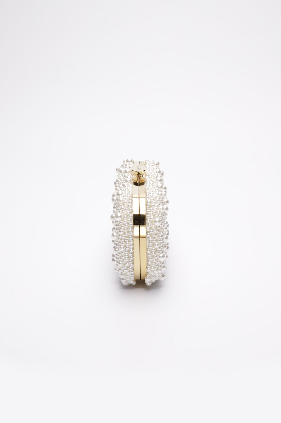 True Love Pearl Clutch with hand-sewn pearls with a gold hardware frame.