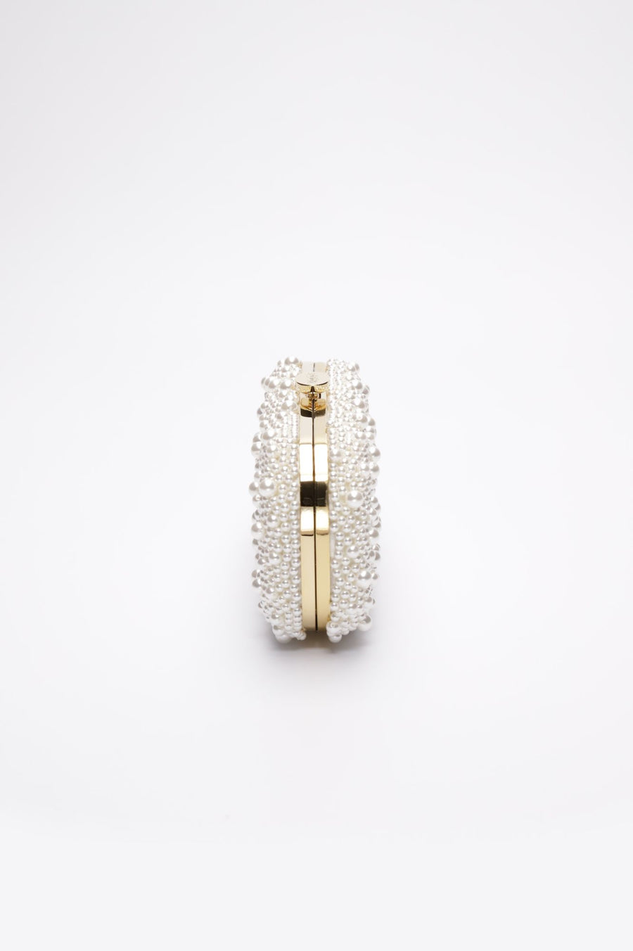 True Love Pearl Clutch with hand-sewn pearls with a gold hardware frame.