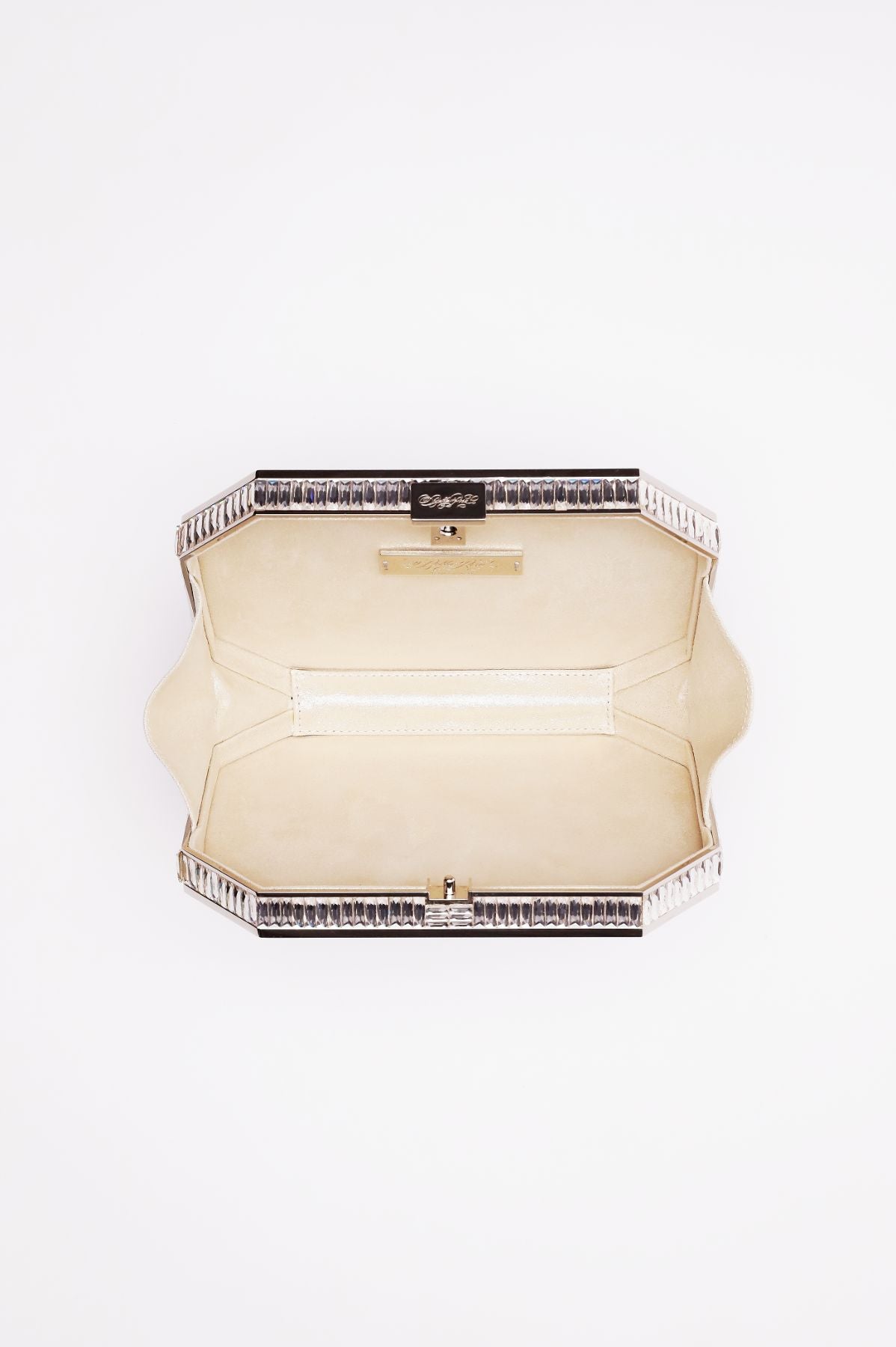 Top open view of Como clutch in white satin with silver gemmed frame.