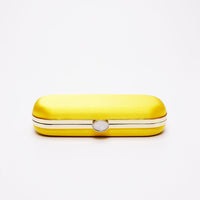 Top closed view of Bella Clutch in Limoncello yellow satin with gold hardware frame.