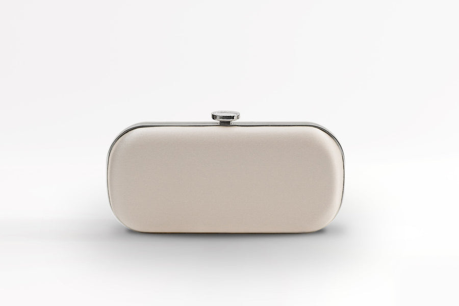 Front view of satin Bella Clutch in champagne satin with silver hardware.