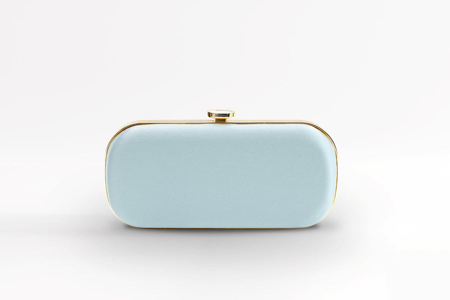 Front view of bridal Bella Clutch in light iced blue with gold hardware accents and stimulated mother of pearl clasp.