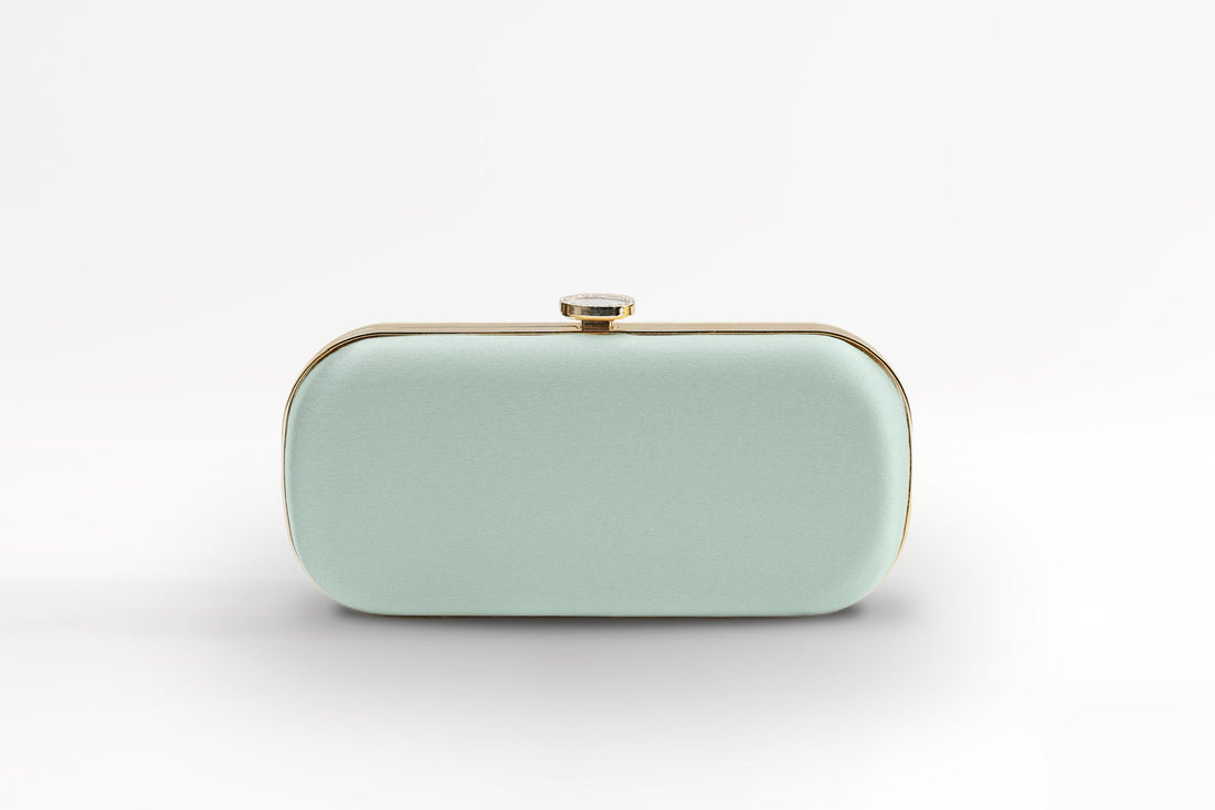 Front view of satin Bella Clutch in sage green satin with gold hardware.