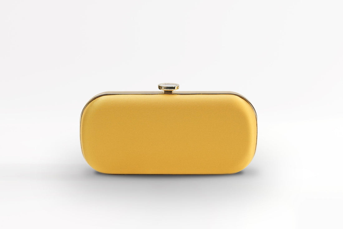 Front view of bridal Bella Clutch in limoncello yellow with gold hardware accents and stimulated mother of pearl clasp.