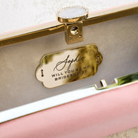 A customized Bridesmaid Proposal Box with Engraved Bella 'Be My Bridesmaid' Clutch Bag Gift from The Bella Rosa Collection, perfect for bridesmaids.