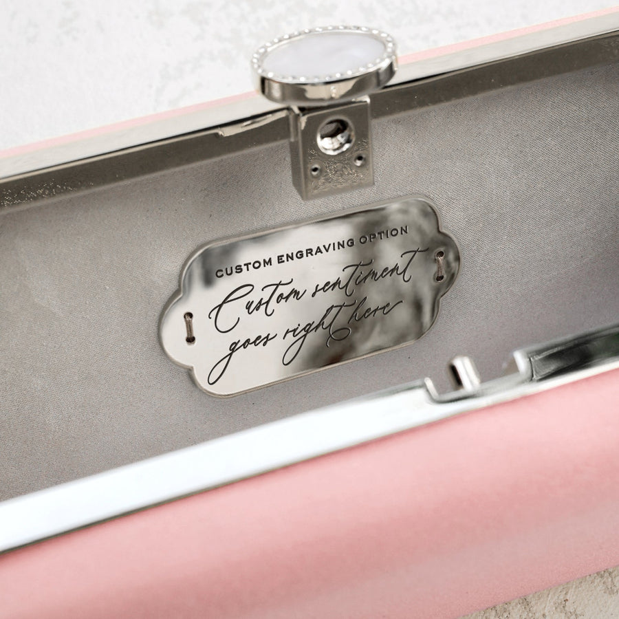 A pink Satin Bella Clutch case with a silver plaque, handcrafted in Italy by The Bella Rosa Collection.