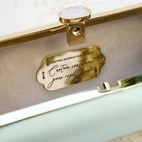 A Bat Mitzvah Personalized Bella Clutch Petite in mint green with a gold plaque, perfect for a personalized Bat Mitzvah gift.