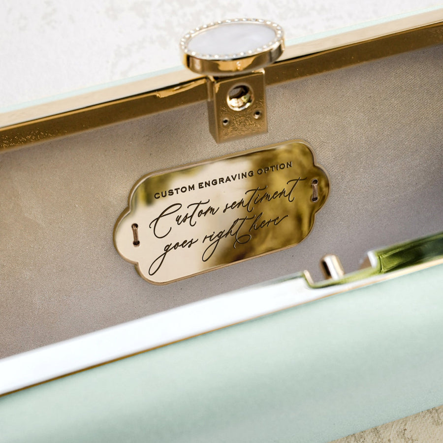 A Bat Mitzvah Personalized Bella Clutch Petite in mint green with a gold plaque, perfect for a personalized Bat Mitzvah gift.