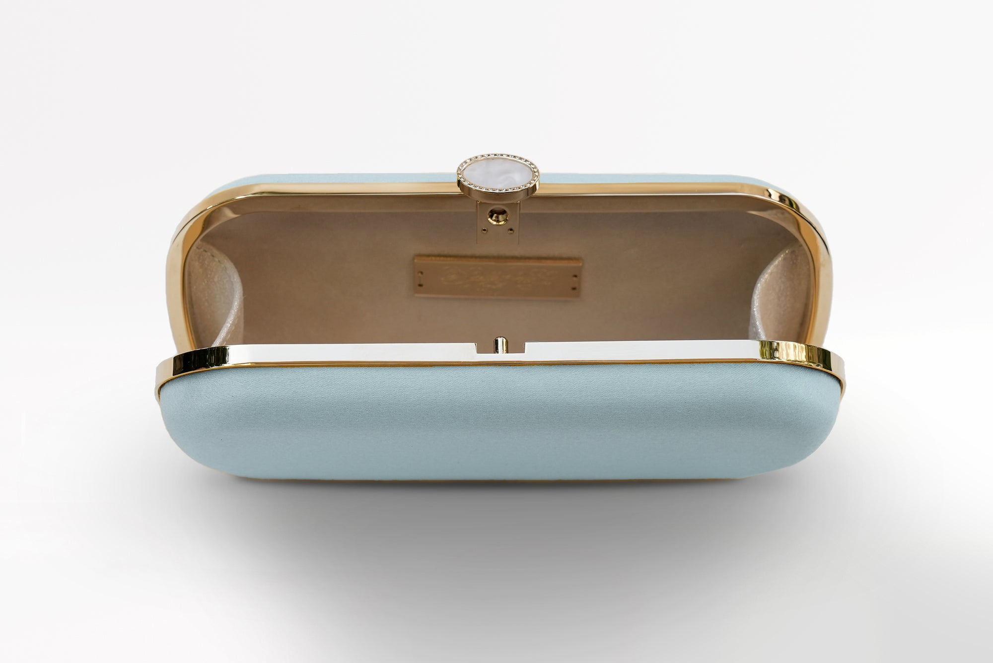 An elegant Mini Cinderella Blue Bella Clutch with gold accents, open to reveal the interior from The Bella Rosa Collection.