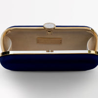 The Bat Mitzvah Personalized Bella Clutch Petite, part of The Bella Rosa Collection, stands out with its elegant blue and gold design. Placed on a pristine white surface, this clutch bag is the perfect personalized gift for Bat Mitzvah celebrations.