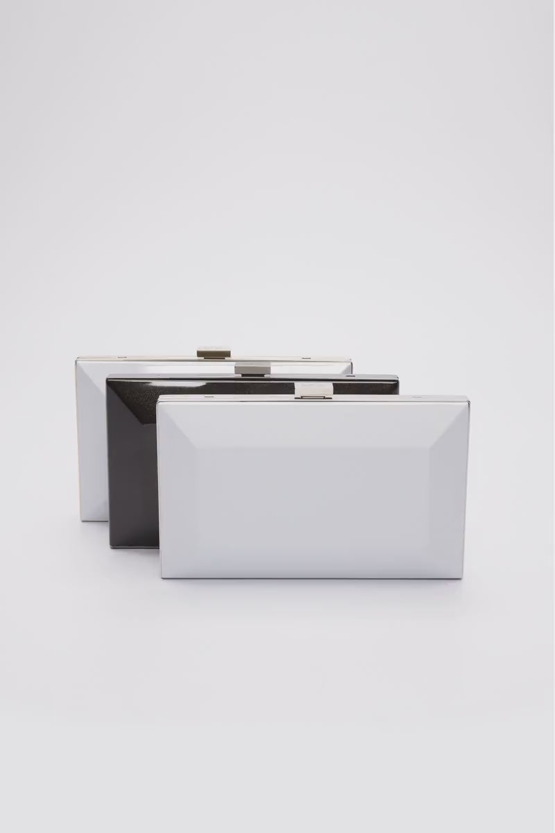 360 view of three Milan clutch with a geometric beveled metal frame in black, white, and pearl white.