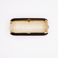 Top open view of Bella Clutch in black satin with gold hardware frame.