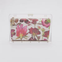 360 view of Mia Fiori Clutch with a clear acrylic rectangle case with floral print satin pouch interior.