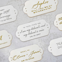 wedding favor tags with Snow White Shimmer Bella Clutch and silver lettering by The Bella Rosa Collection.