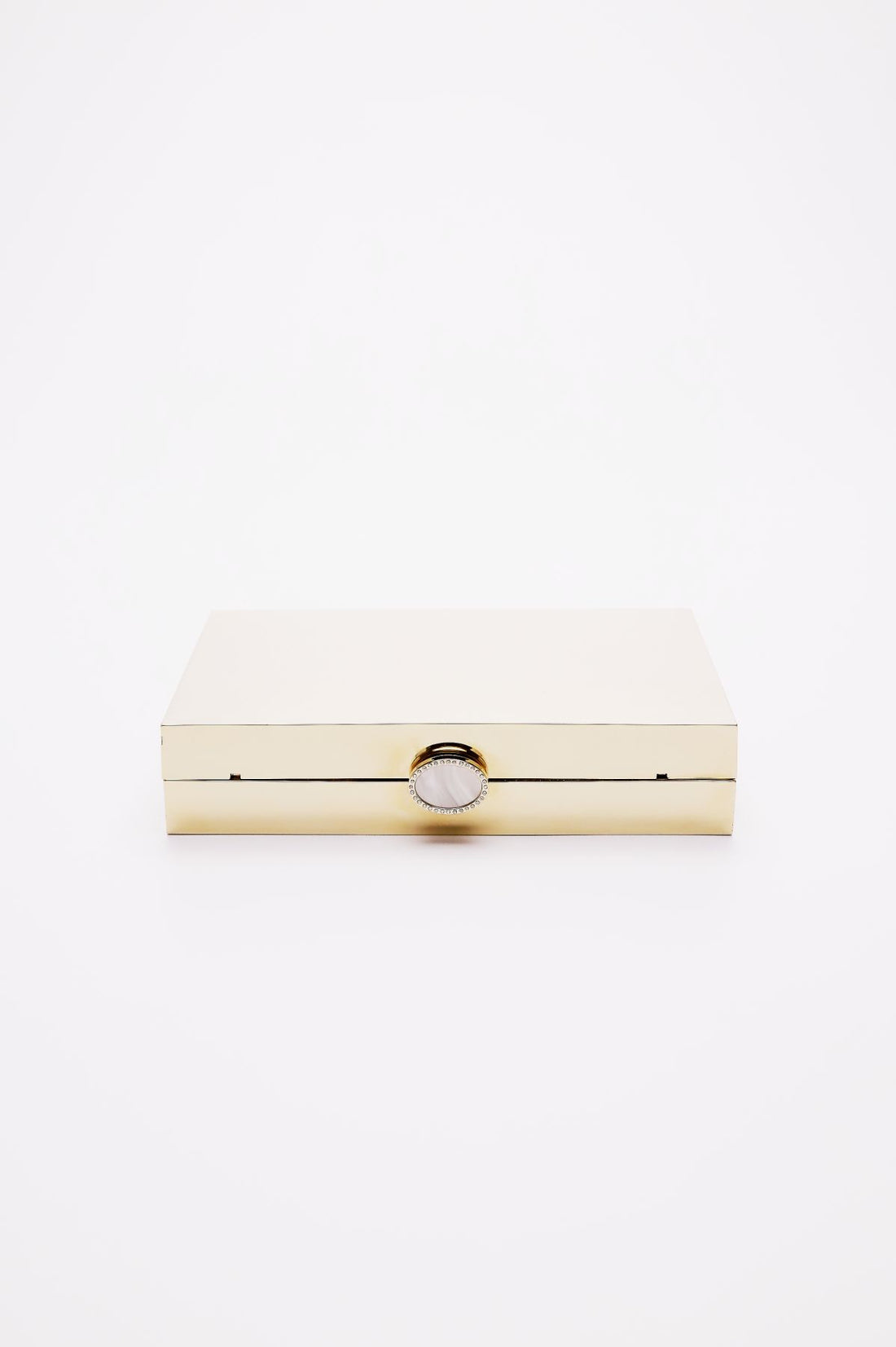 Side top view of Ella Clutch closed in gold mirror finish.