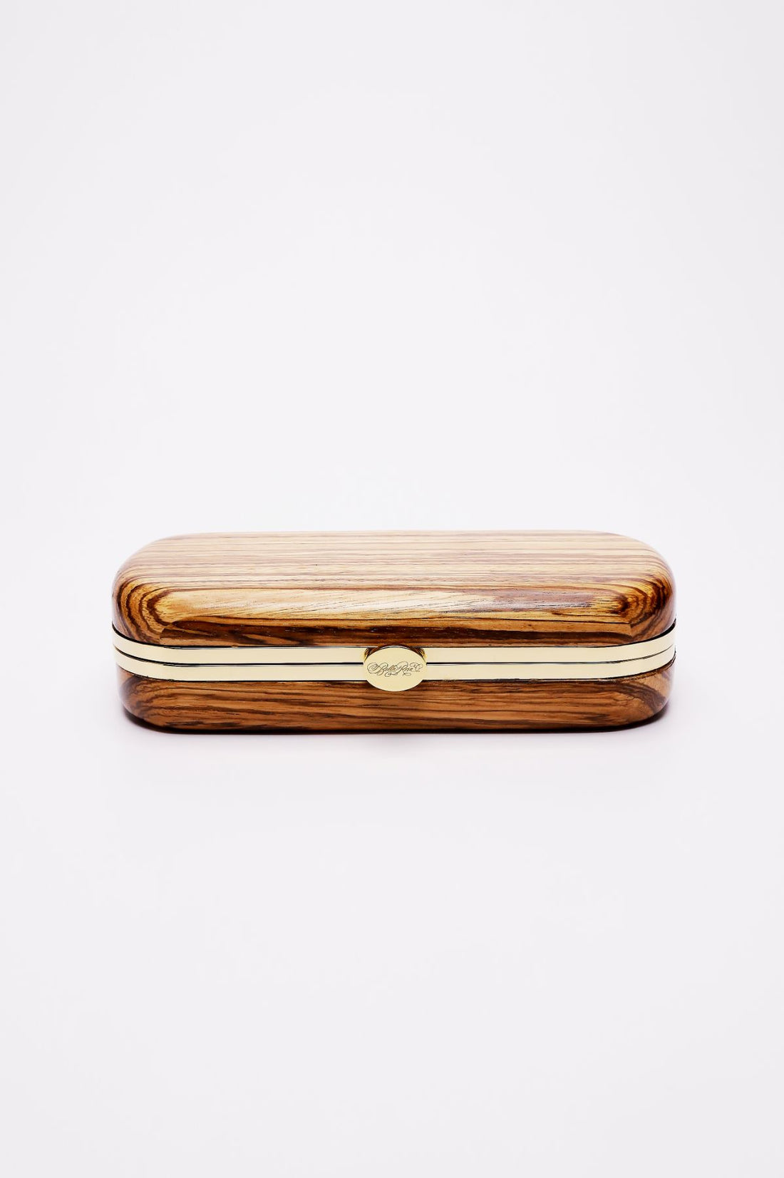 A sustainably sourced Bella Clutch African Zebra Wood Petite eyeglass case with a metal clasp on a white background by The Bella Rosa Collection.
