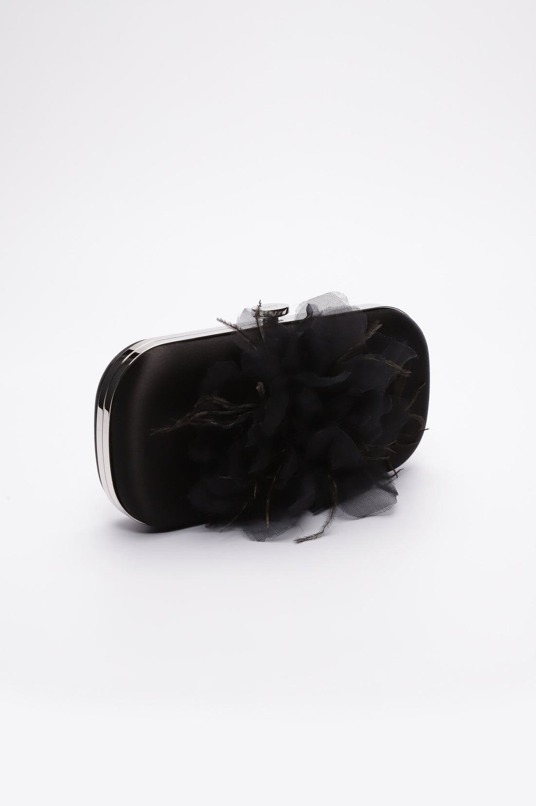 Side view of Bella Fiori Clutch in black satin with black flower adored on front side.