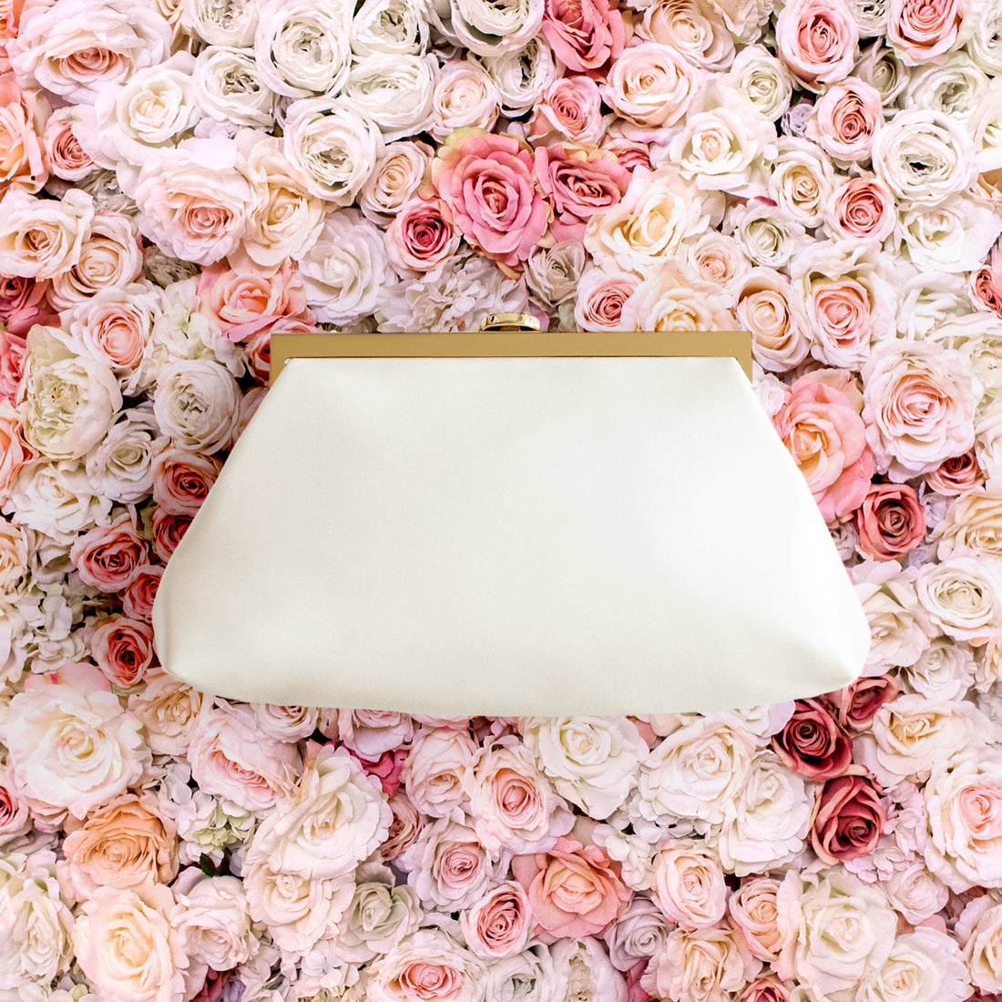 Rosa Clutch in Ivory white satin with gold hardware clasp frame.